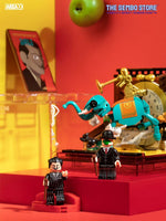 Salvador Dali minifigures from the Inspiration from Art BOX series by Area-X on a red background with an apple in the top centre. 